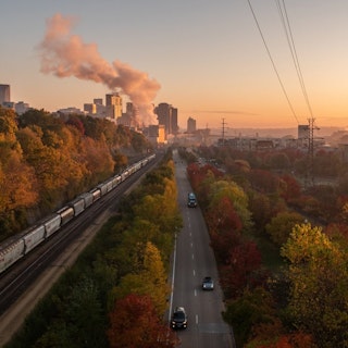 A train traveling through the High Bridge in the fall in Saint Paul, MN.